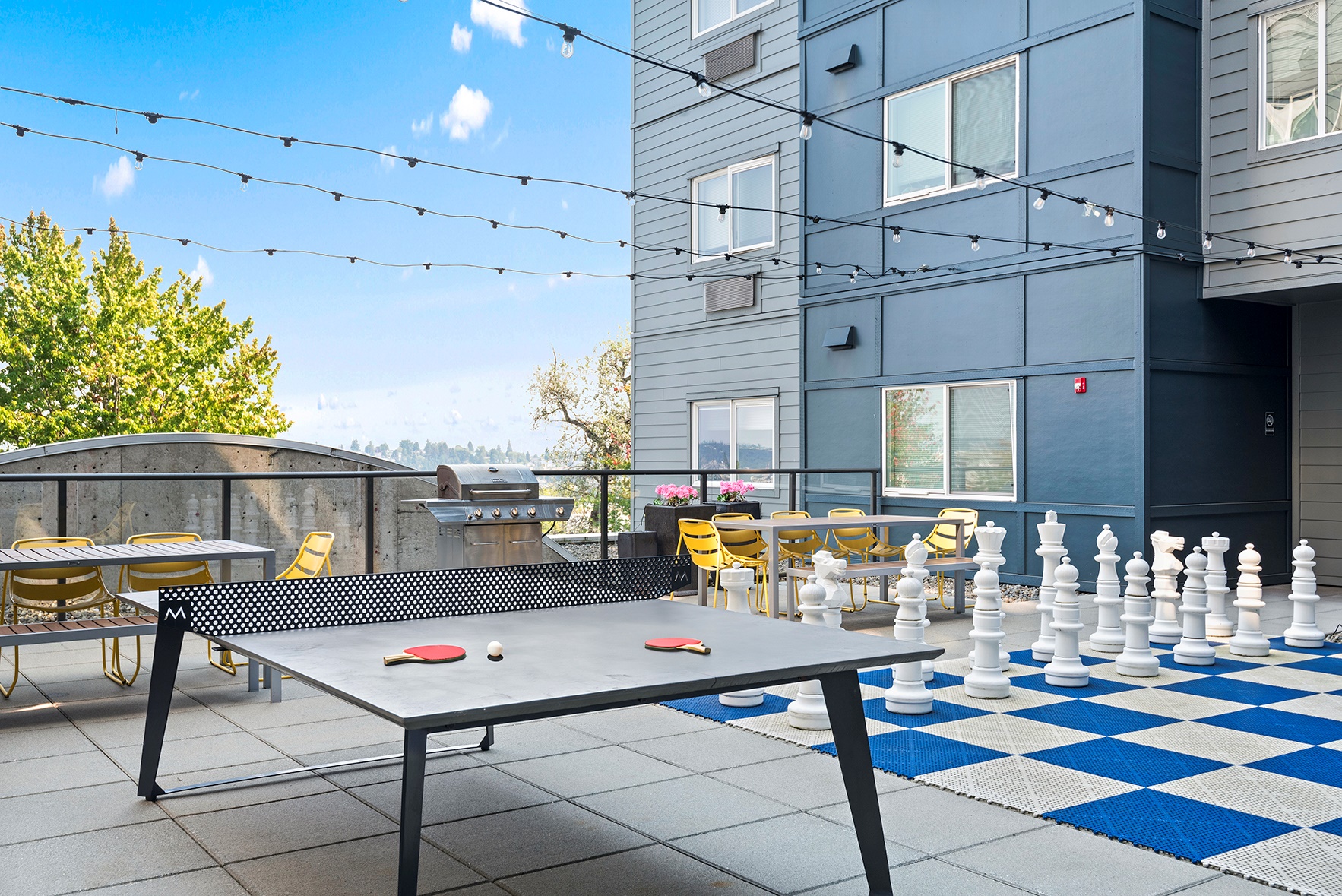 a large courtyard with a ping pong table